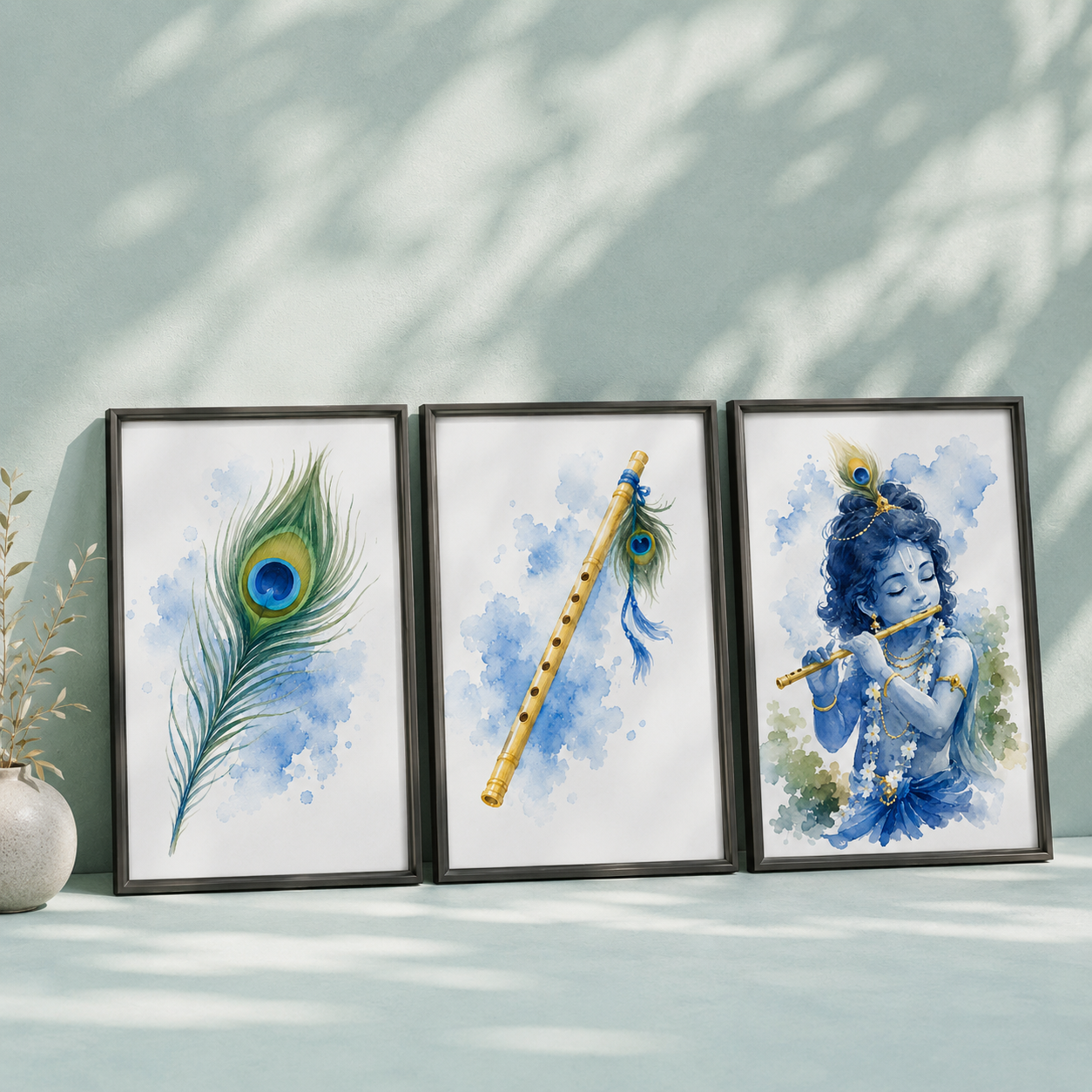 Set of three unframed watercolor prints — peacock feather, flute, and Krishna playing flute